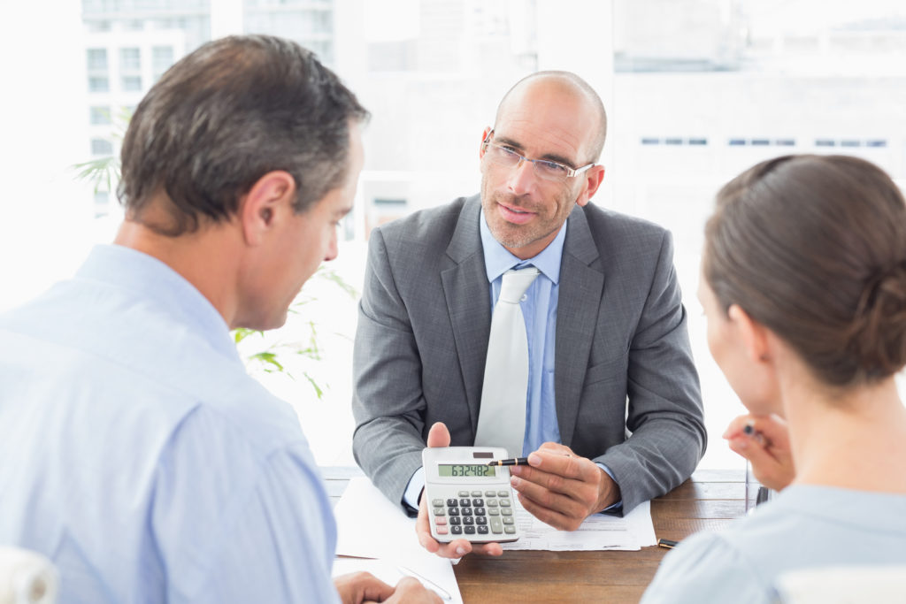 a financial advisor showing the calculations